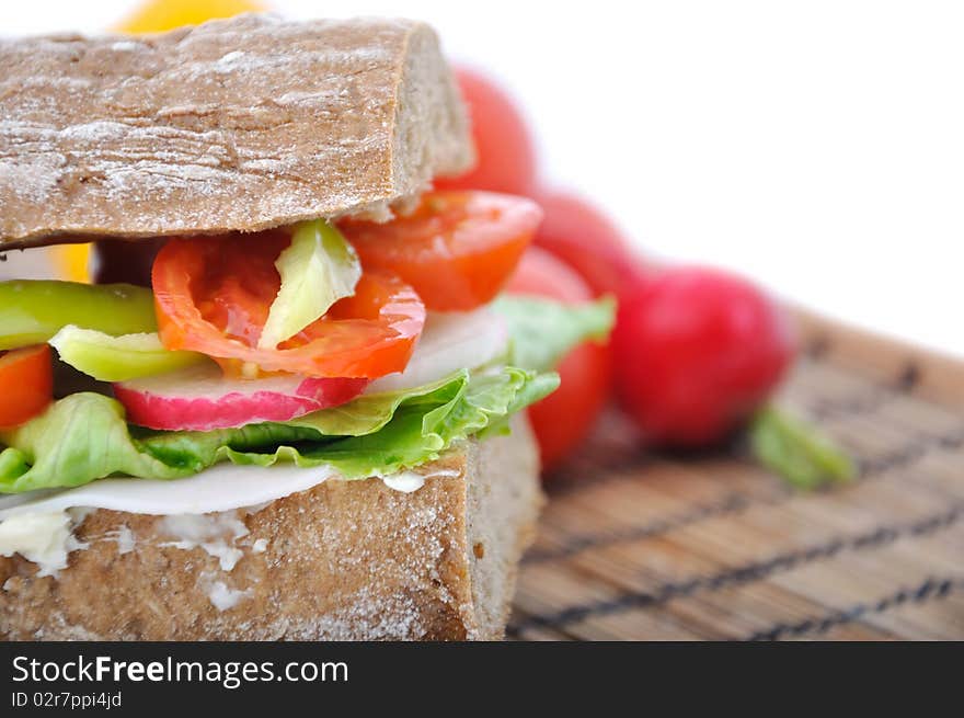 Closeup diet brown baguette with vegetable on white background