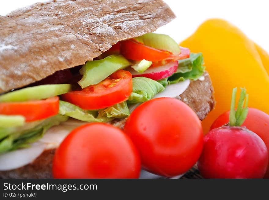 Closeup diet brown baguette with vegetable on white background