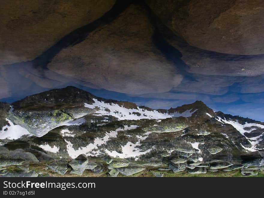 Mountain reflecting in pond in the Pirin range - Bulgarian balkans