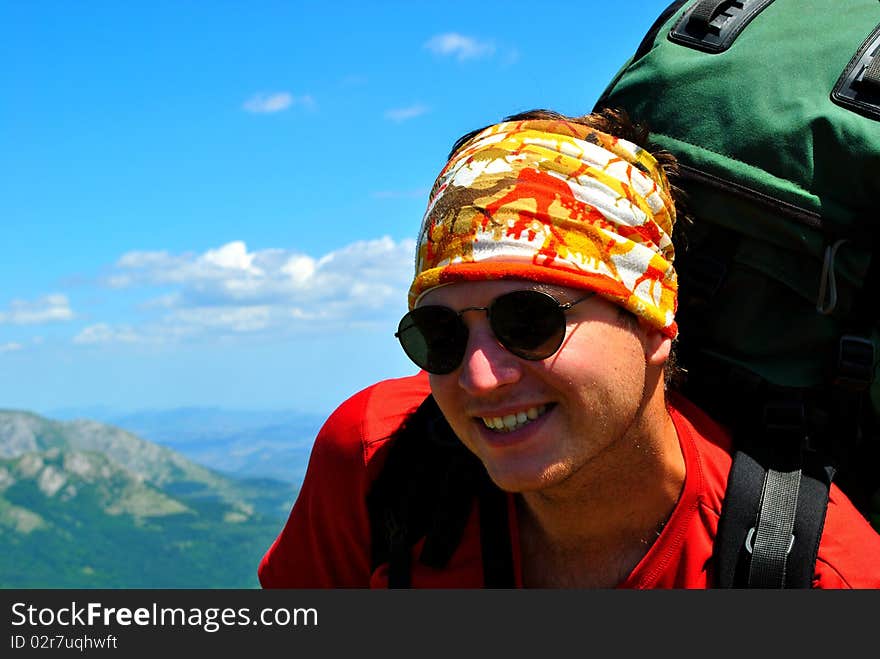 Hiker in mountains, beautiful landscape in background. Hiker in mountains, beautiful landscape in background