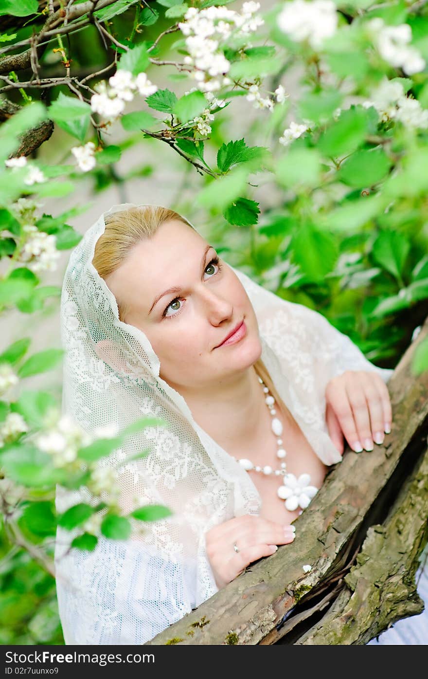 Beautiful bride in blooming garden closeup. Beautiful bride in blooming garden closeup