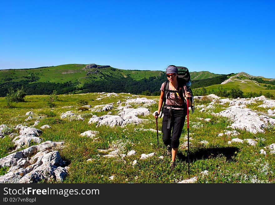 Woman hikng in mountains