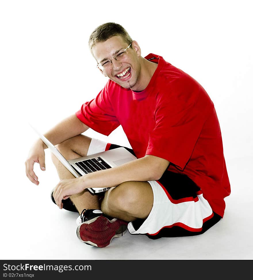 Young Man Sitting With Laptop, Laughing