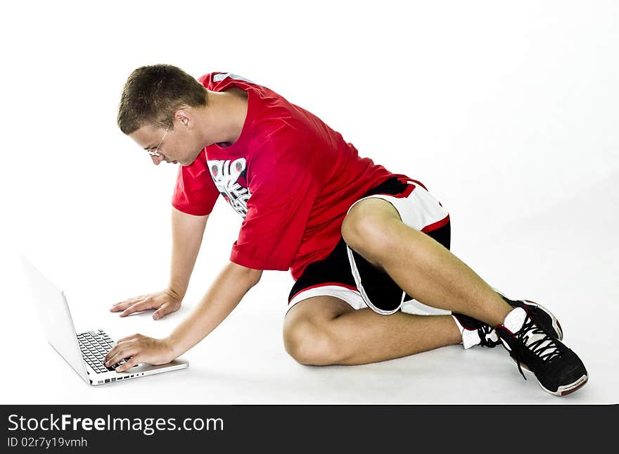 Teenager with laptop, isolated on white background