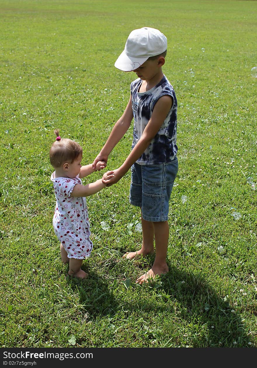 Children happily playing on the grass