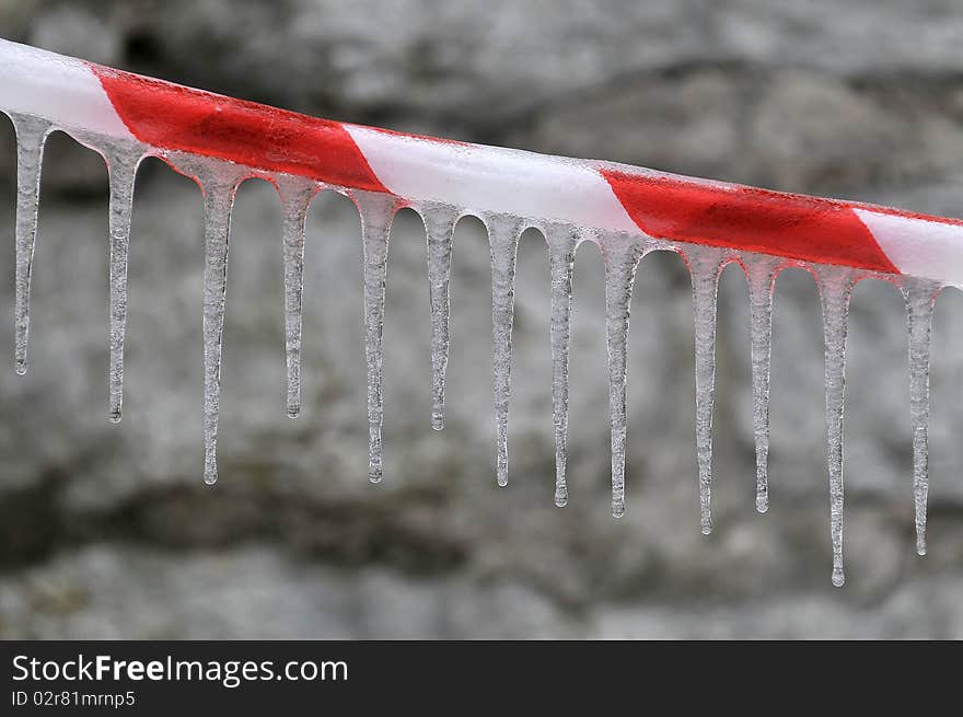 Deserted strip with a icicled on the stone background