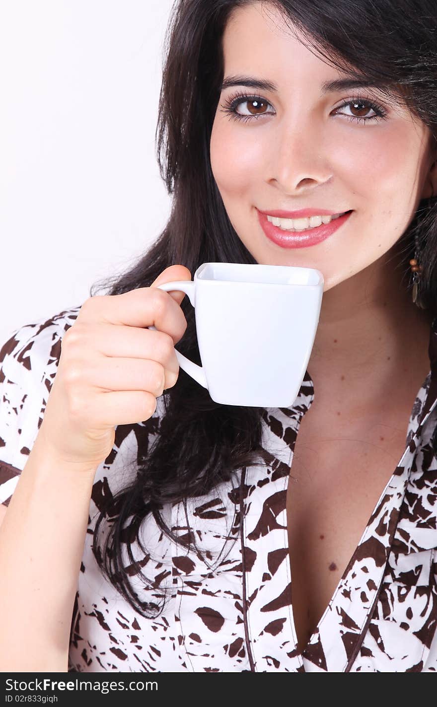 Woman drinking coffee in a white cup