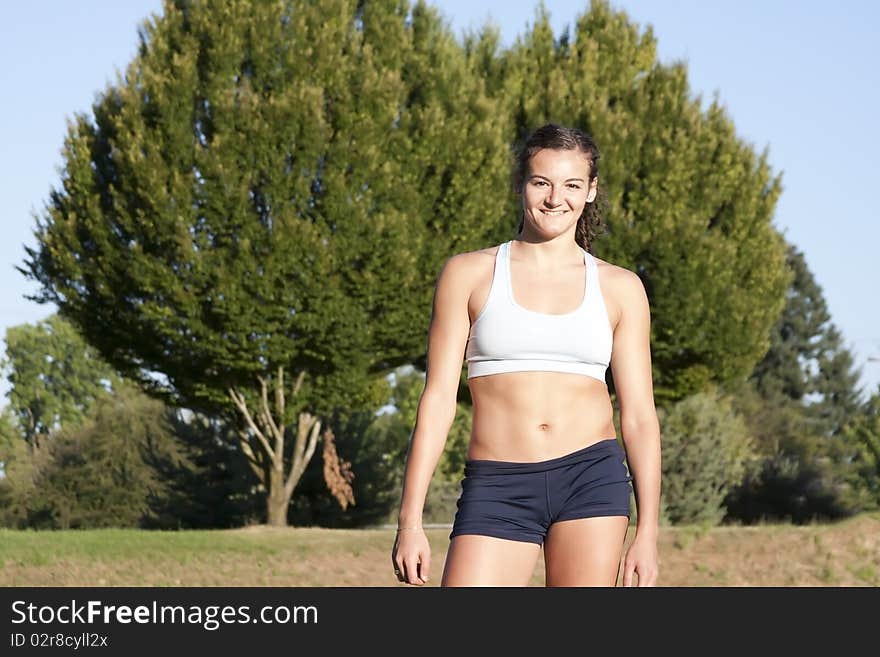 Portrait of Young, Attractive Female Athlete with Brown Hair Smiling. Portrait of Young, Attractive Female Athlete with Brown Hair Smiling.