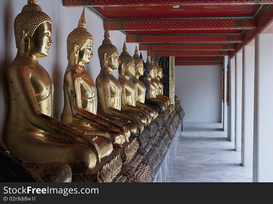 The perspective view of the buddha images or statues in a temple in Bangkok, Thailand. The perspective view of the buddha images or statues in a temple in Bangkok, Thailand.