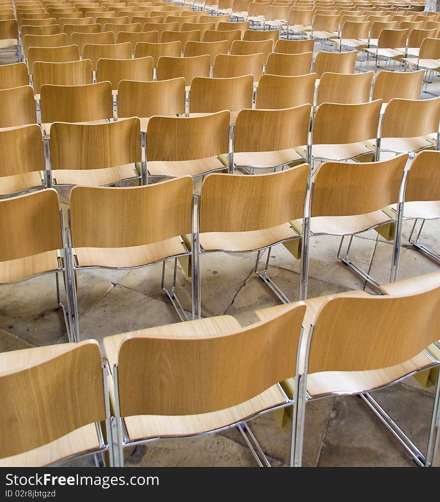 Multiple rows of aligned chairs.