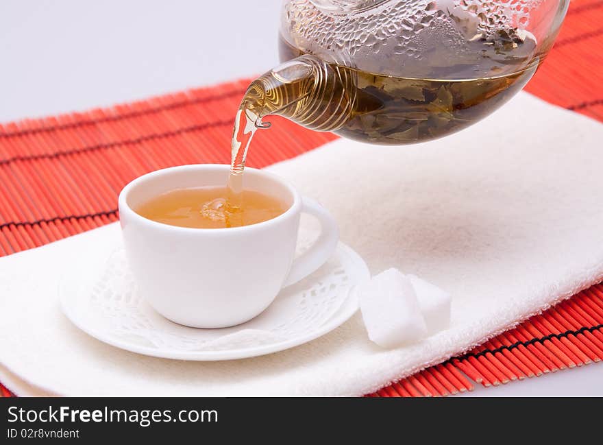 Pouring Green Tea into Cup