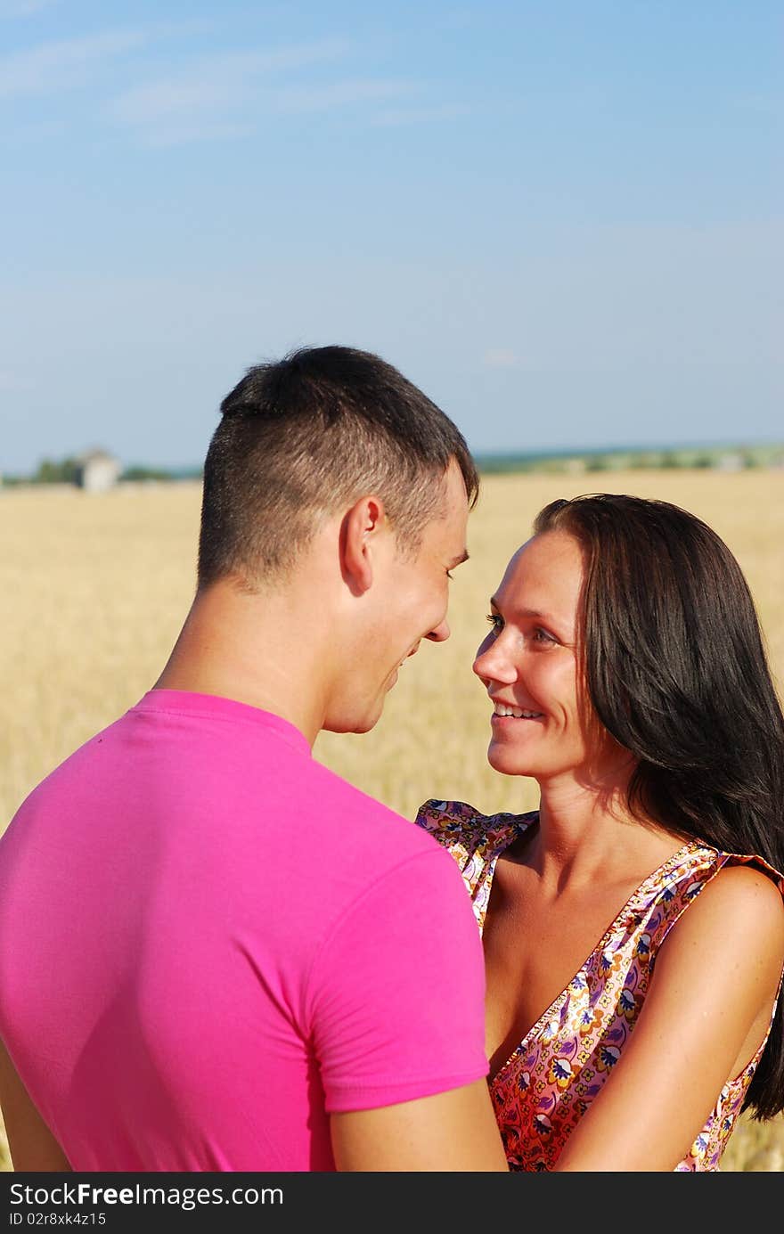 Close-up of  young couple loving in rural wheat field. Close-up of  young couple loving in rural wheat field