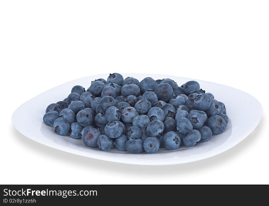 Blueberries on the plate isolated on white