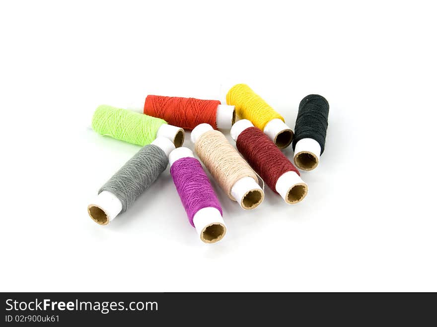 Group of spools of thread on white background