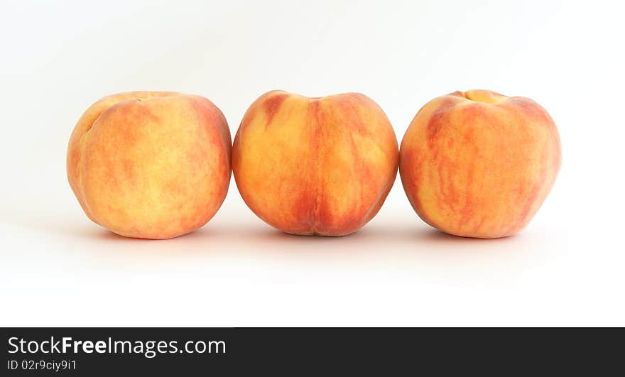 Three large ripe peaches