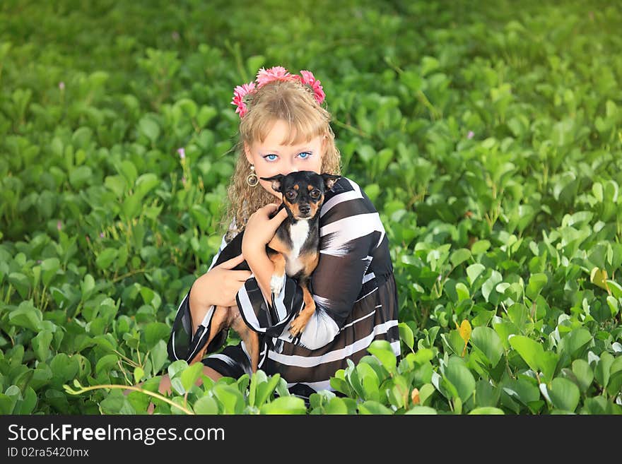 Beautiful young woman with her pet dog outdoor. Beautiful young woman with her pet dog outdoor