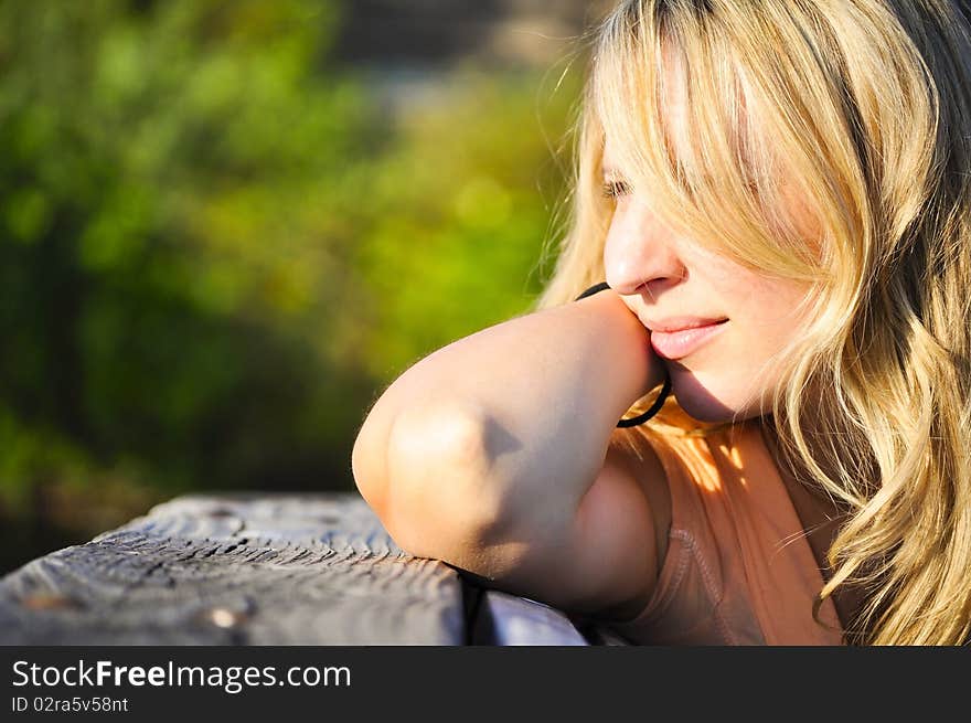 Girl Looks Into The Distance At Sunset