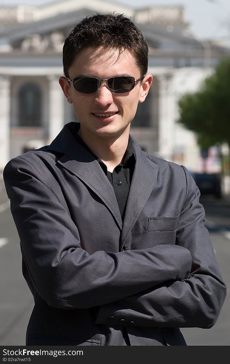 Young adult european man in black sunglasses