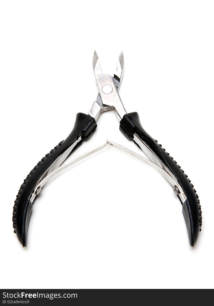 Manicure scissors with black handle on white background