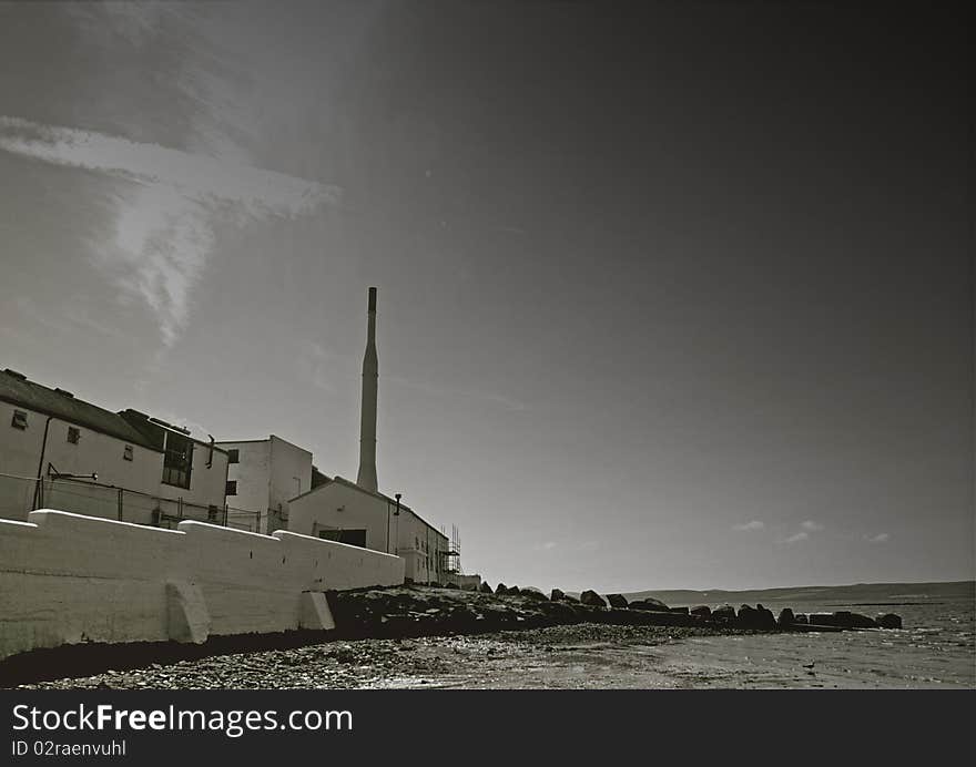 Old scottish distillery, traditionally on a water front.