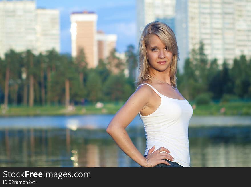 Attractive girl relaxing at the lake. Attractive girl relaxing at the lake