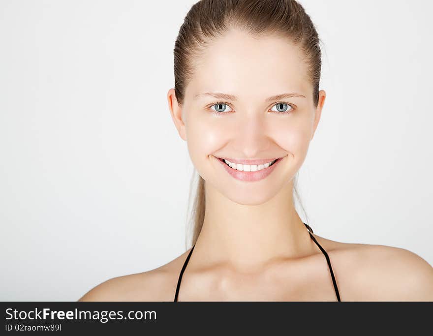 Attractive smiling woman portrait on white background