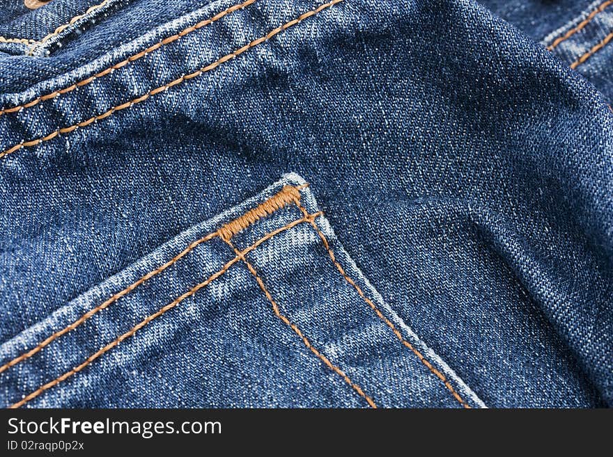 Pocket detail of blue denim jeans