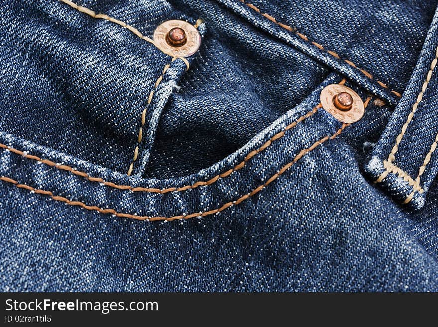 Pocket detail of blue denim jeans