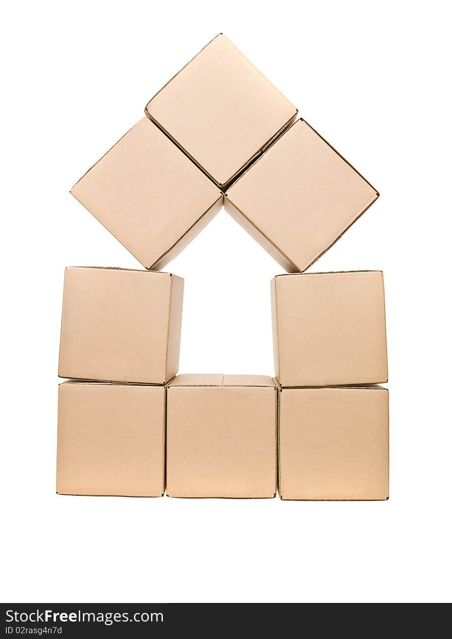 Cardboard boxes formed as a house isolated on white background