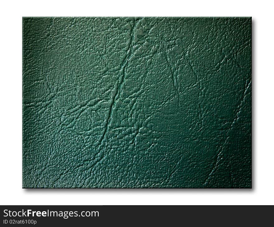 Dark green leatherette texture on white background. Dark green leatherette texture on white background