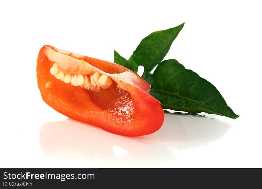 Red cut pepper and green leaf