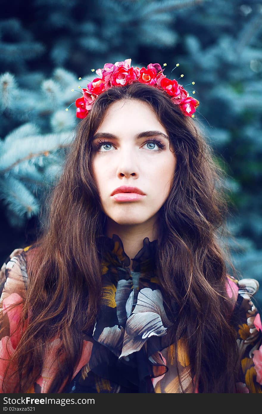 Pretty woman in the garden with headband