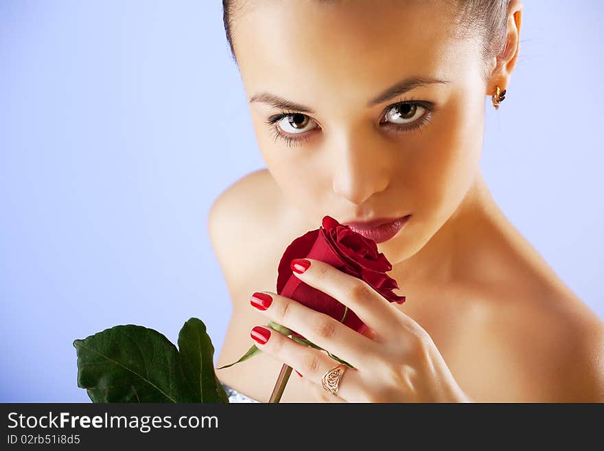 Portrait of sensual beautiful woman with rose