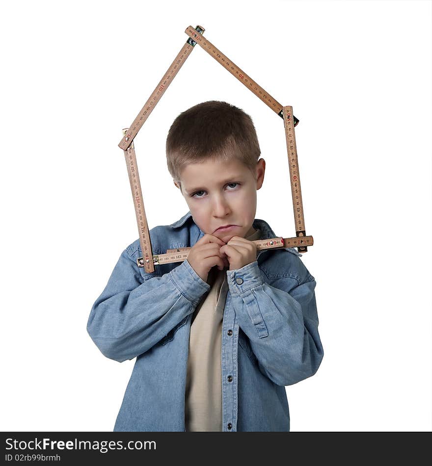 Young sad boy holding house-shaped measuring tape