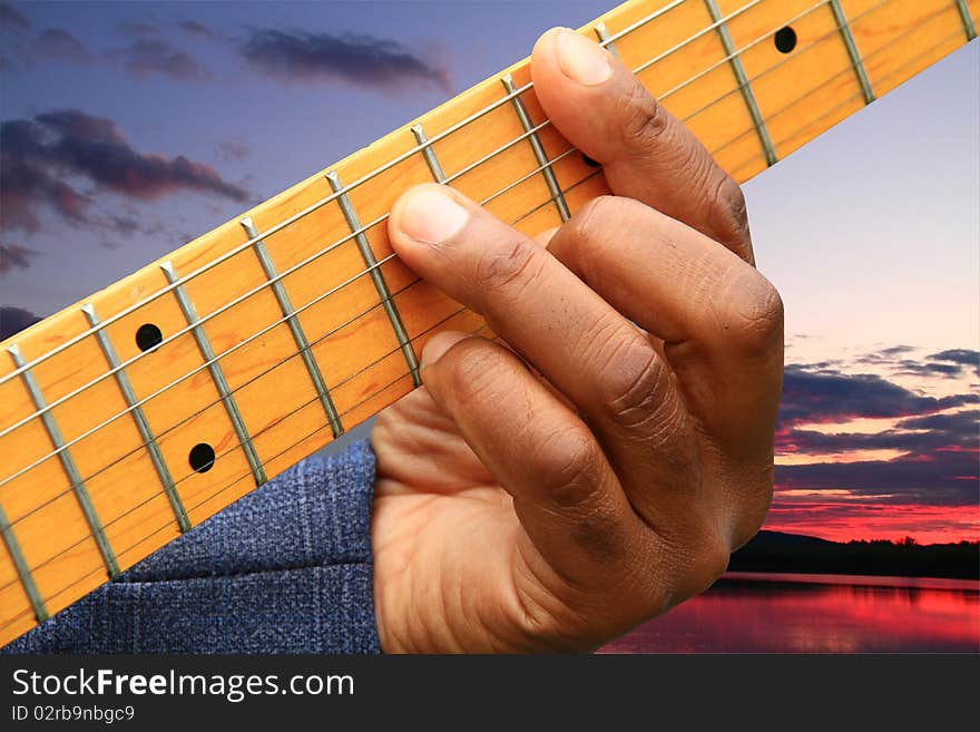 A guitar player on a lake side in Czech. A guitar player on a lake side in Czech