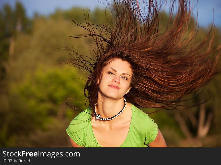 Young woman with hair flying