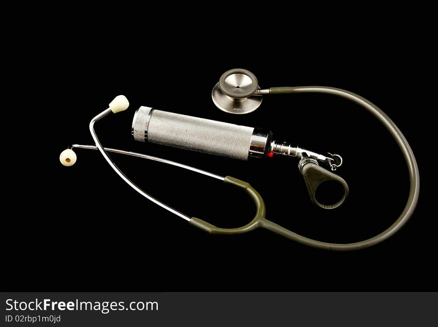 This is an image of an atique stethoscope and otoscope. This is an image of an atique stethoscope and otoscope.