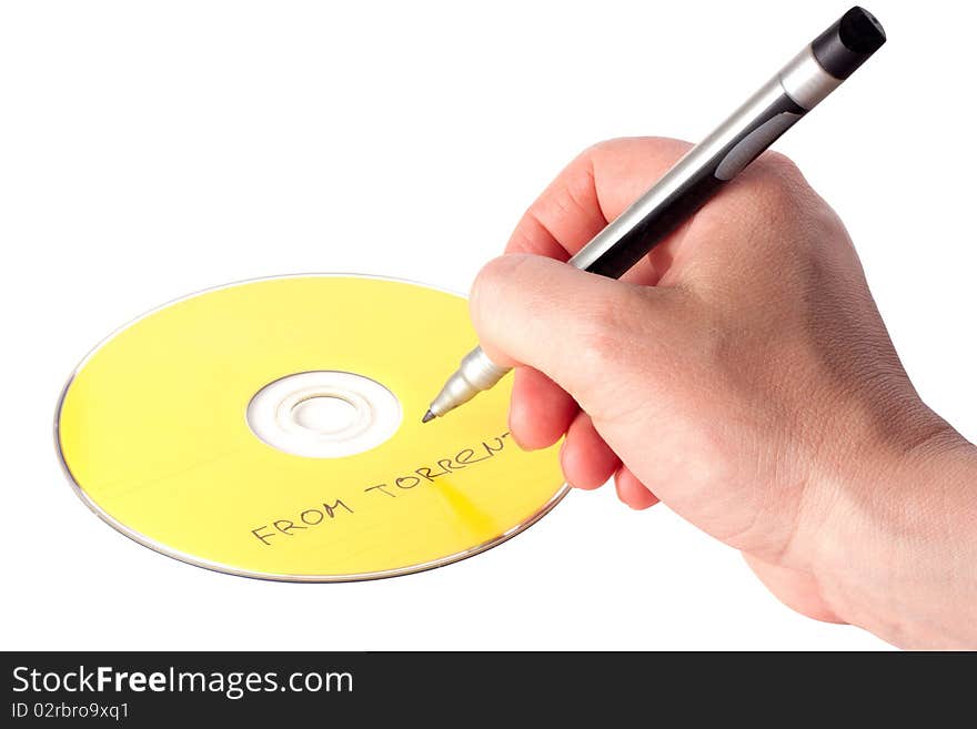 Man's hand writing on DVD with content from torrents