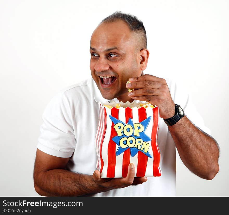 Office worker eating popcorn and enjoying