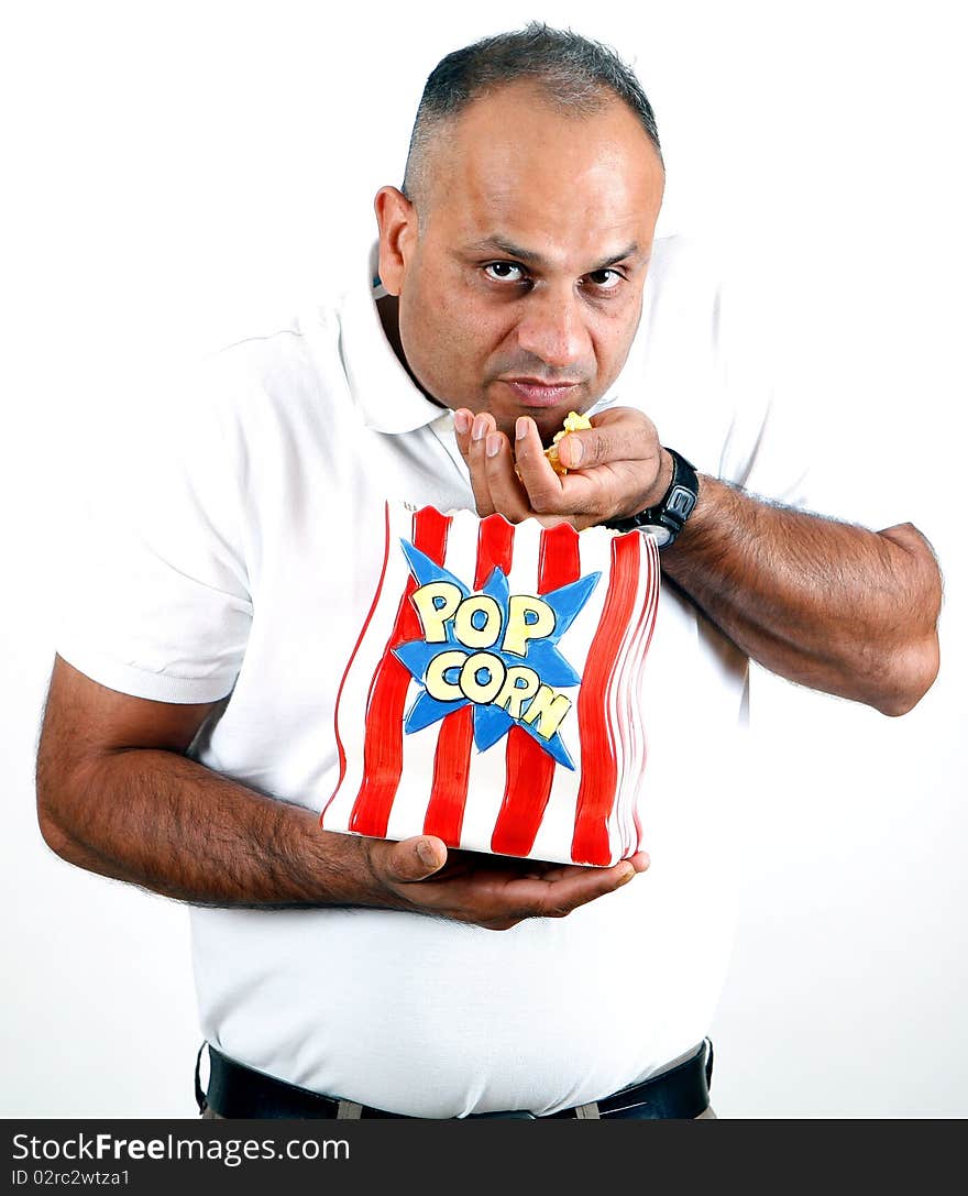 Office worker eating popcorn and enjoying