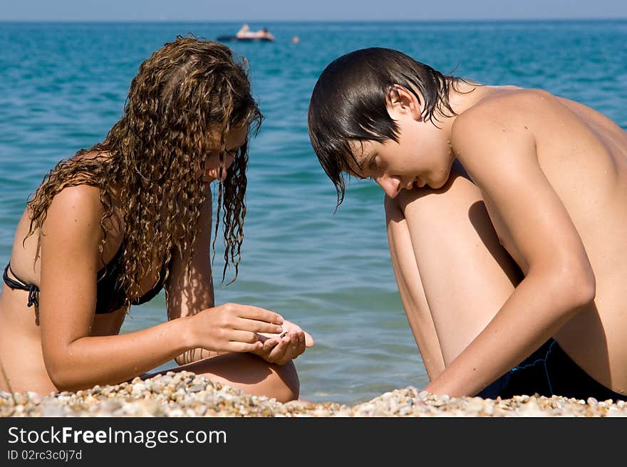 Boy And Girl On The Beach