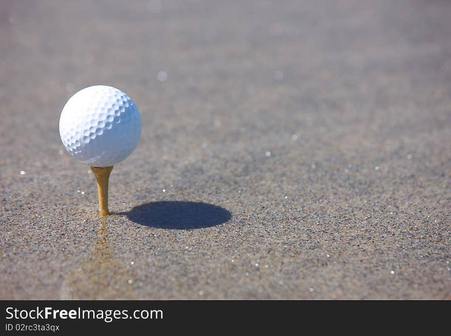 Golf ball in the beach