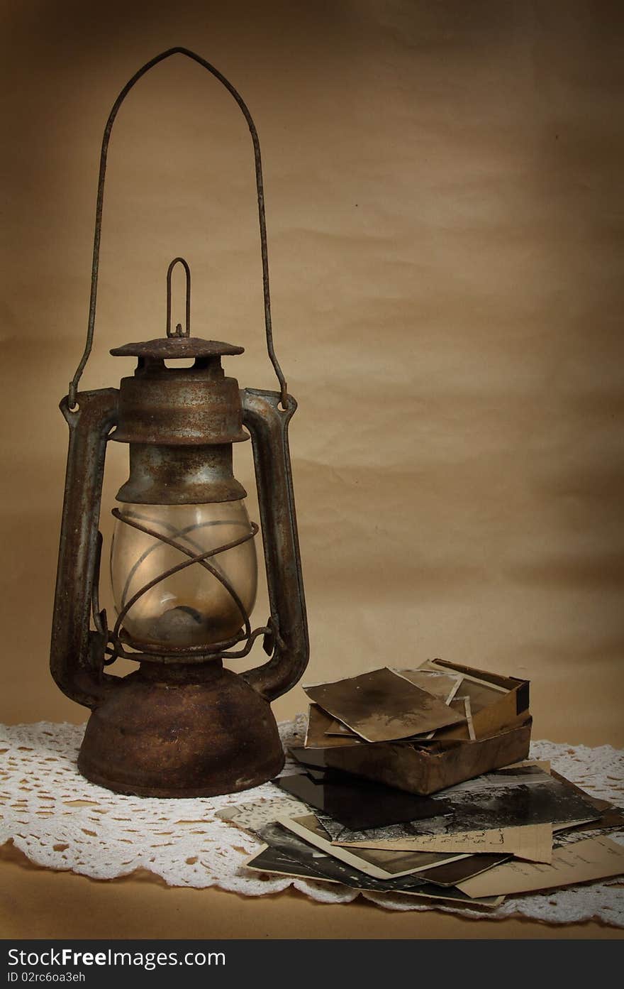 Old kerosene lamp and photos