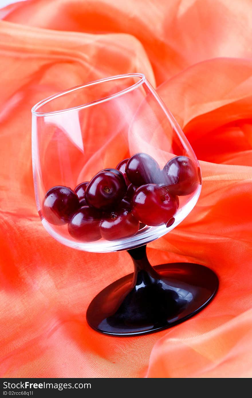 Cherries in the footed glass