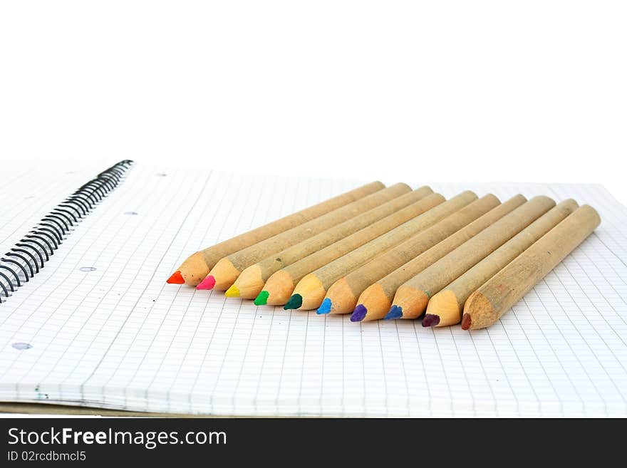 Wooden color pencils isolated on a white background