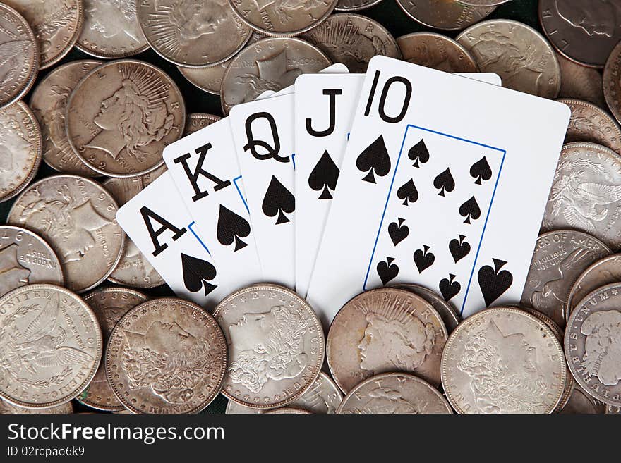 Winning hand and stacks of silver dollars. Winning hand and stacks of silver dollars