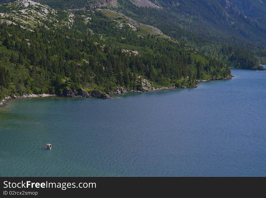 Boating on a high mountain lake. Boating on a high mountain lake