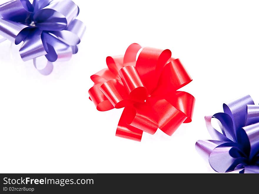 Red and blue bows on white background. Red and blue bows on white background