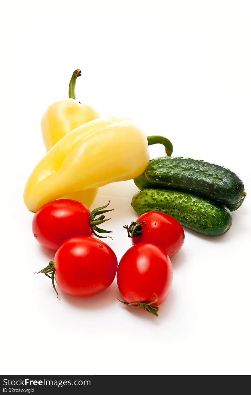 Tomato, cucumber and pepper on white background. Tomato, cucumber and pepper on white background