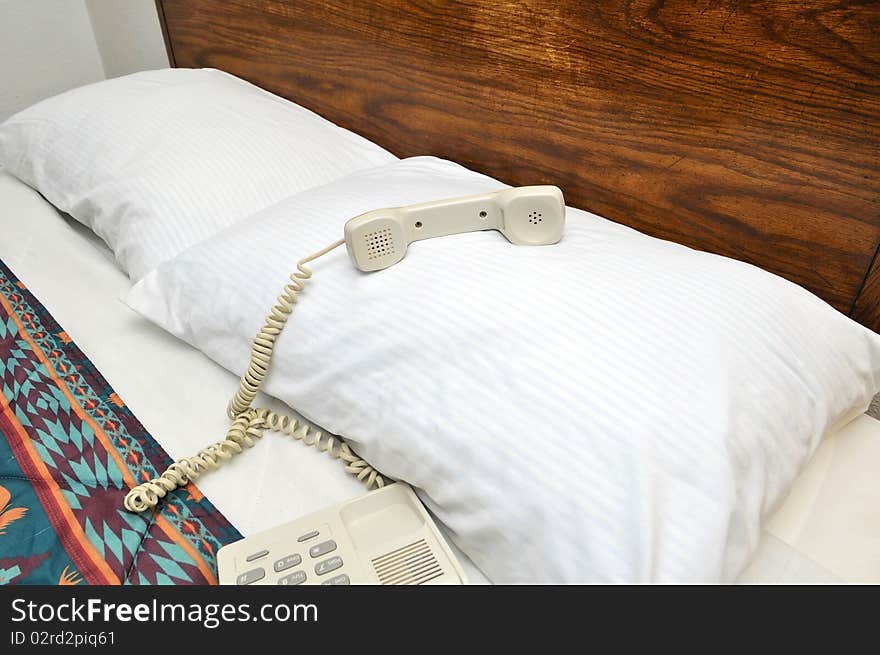 Telephone on bed pillow